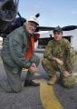 HARS (Historical Aircraft Restoration Society) Flight Engineer Mr Kim Flattery, who flew to RAAF Base Edinburgh on the Neptune talks to 11 Squadron Aircraft Technician, Leading Aircraftman Brammall
about the maintenance of the Neptune. 