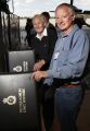 Former 10, 11 and 492 Squadron member Terry Bourile (left) and 10 Squadron Flight Engineer (1942-1945) Ian Speirs go through the 492 Squadron Unit History albums.