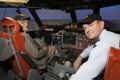 Officer Commanding 92 Wing, Group Captain Warren McDonald straps into the AP-3C Orion flight simulator with former RAAF Flight Lieutenant Dudley Marrows DSO, DFC, the most decorated Sunderland
pilot of World War 2.